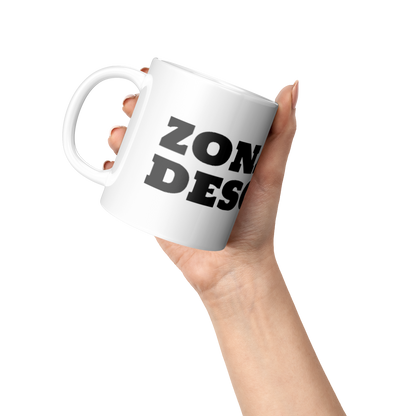 Taza_-_Zona_de_Descarga_Lifestyle_Raised_Hand_LH_Mockup.png
